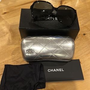 Chanel sunglasses with case, bag, box, paperwork, and cloth.
